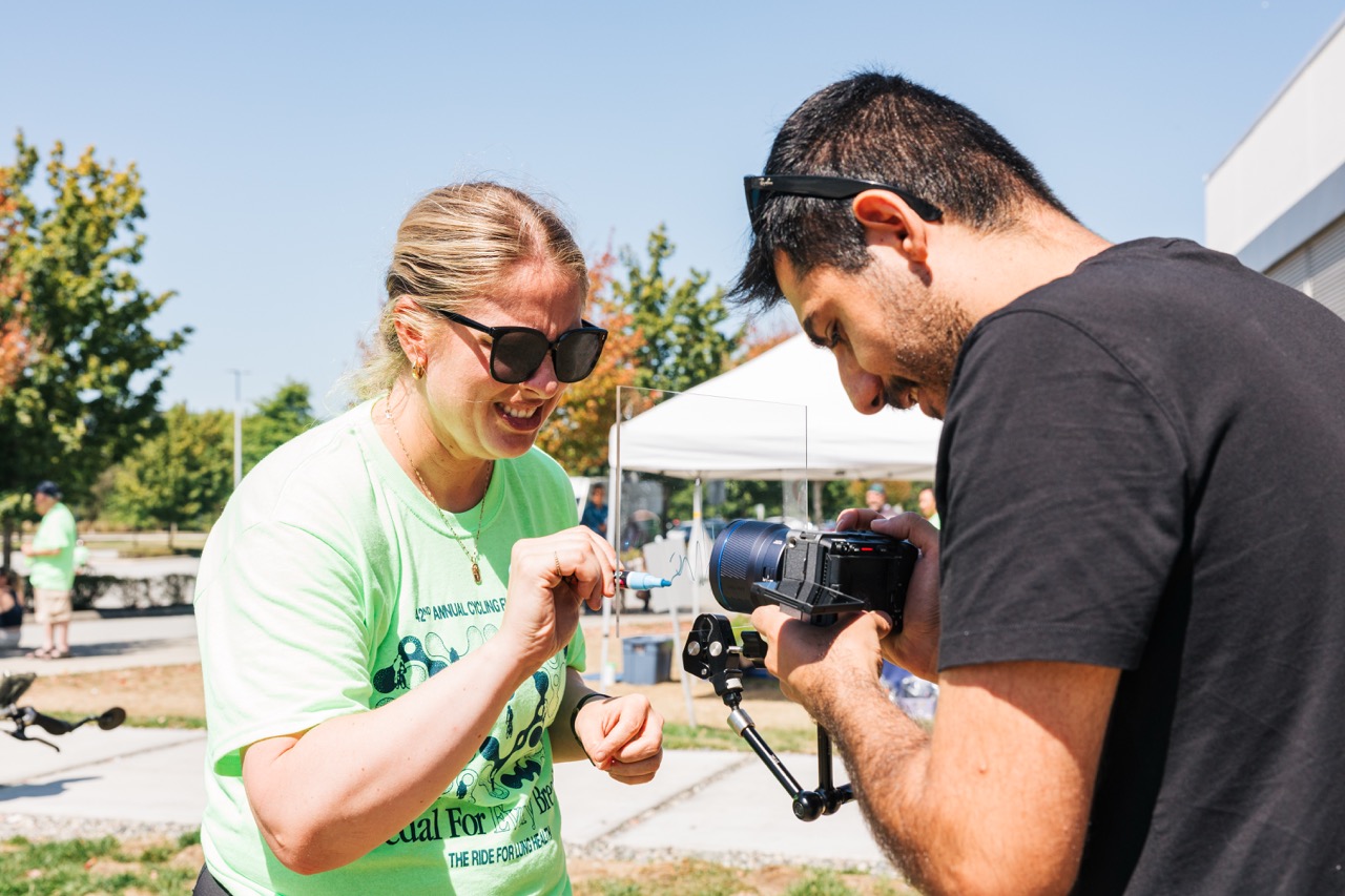 Filming a participant writing on glass